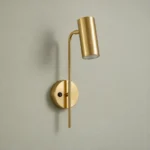 Adjustable Gold Reading Wall Light with Switch — complete fixture in an interior setting