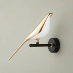 Gold Bird LED Wall Sconce, One Bird — complete fixture in an interior setting