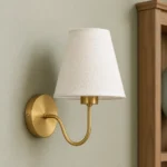 Gold Curved Arm Wall Sconce with Fabric Shade — material and shade detail