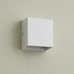 White Up and Down LED Wall Light, 6W — complete fixture in an interior setting